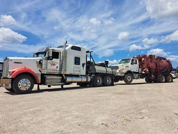 tow truck towing a semi truck