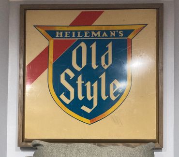 Custom framing of an Old Style sign by Gator Bill Furnishings.