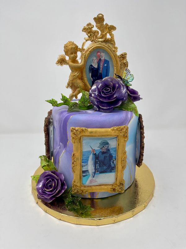 Purple cake with gold frames with photos of people