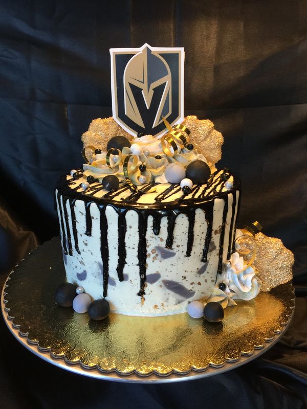 white VGK cake with black drip