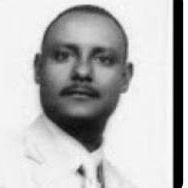 Black and white portrait of a man in formal attire.