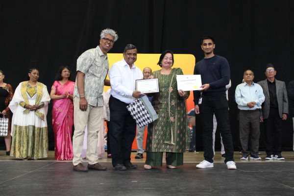 Group receiving awards on stage.