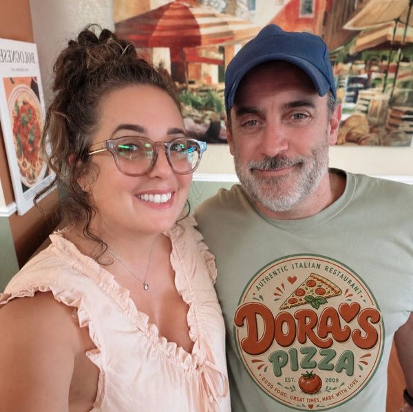 Smiling couple at an Italian restaurant.