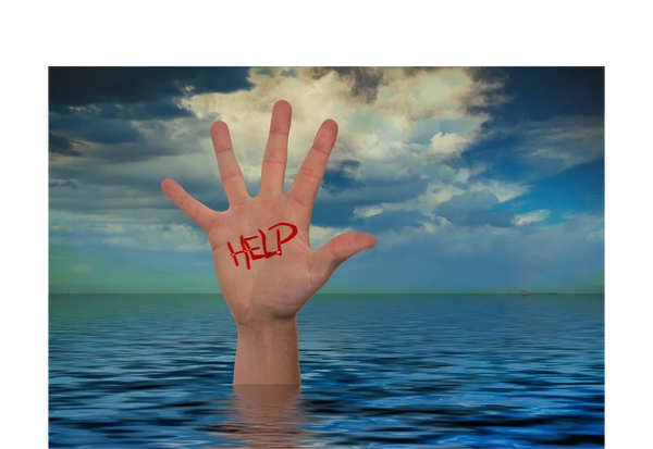 Hand reaching out of water with help written on it