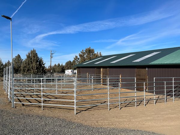 Paddocks outside smaller barn.