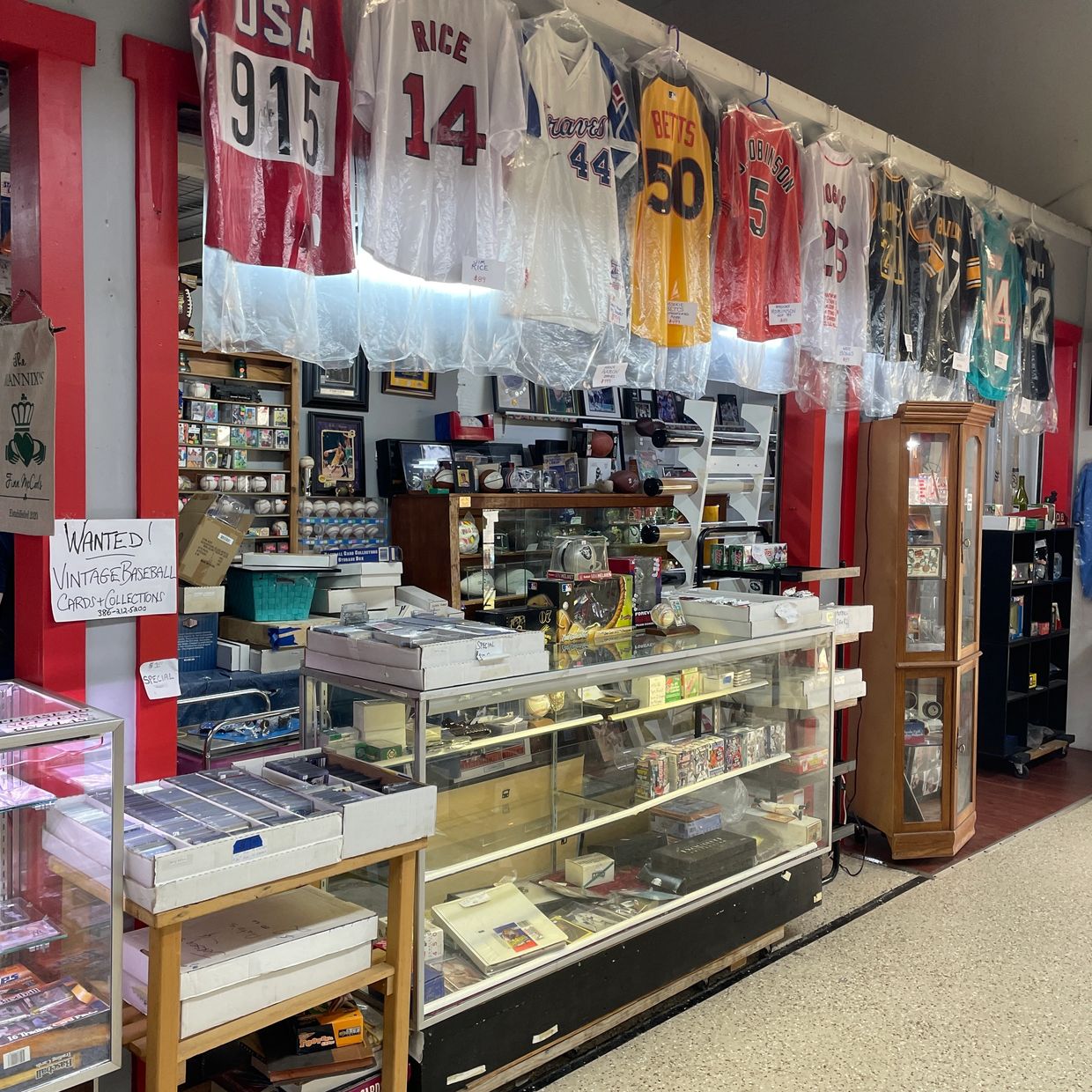 Glass display cases filled with rare sports cards and memorabilia.