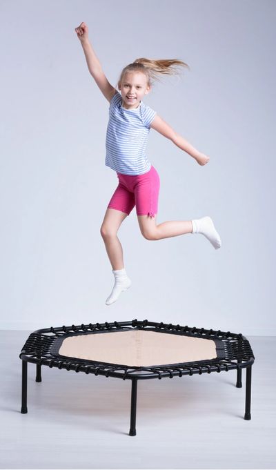 TheraKidz Playhouse Therapy Kids Occupational Therapy girl jumping on trampoline