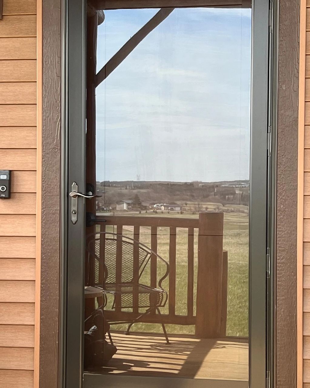 Installed 3M's Exterior Prestige film for maximum heat reduction between the storm and main door.