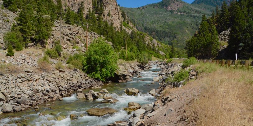 Mountain river flowing through rocky terrain.