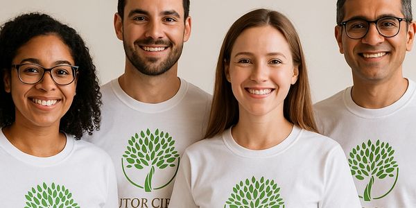 Four smiling people wearing Tutor Circle 'Read To Growth' t-shirts.