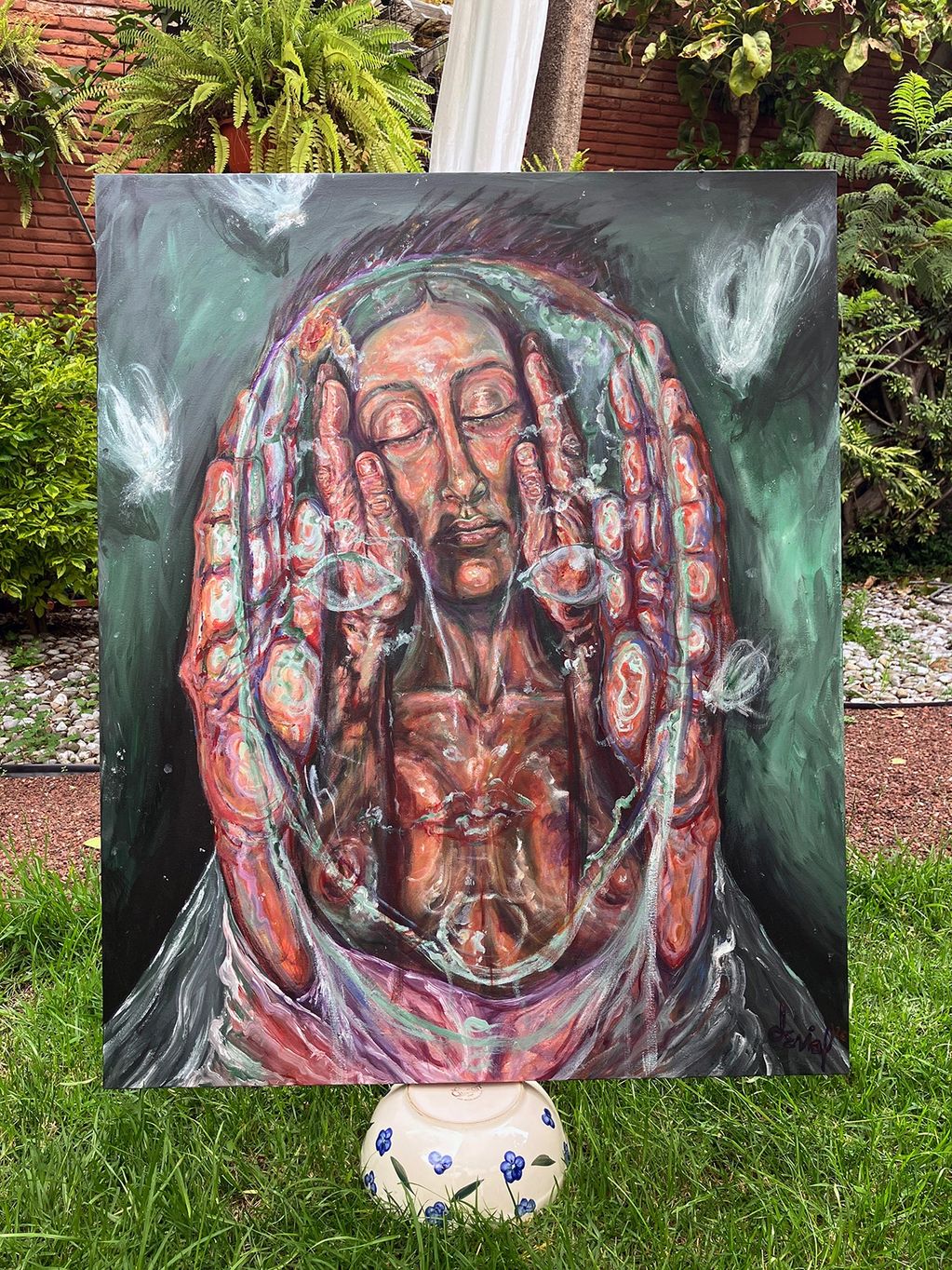 Painting of a serene person encased in an oval, surrounded by glowing butterflies.