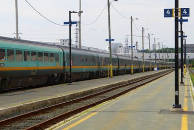 Train stopped at platform 4 at a station.