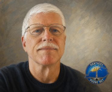 Portrait of an older man with glasses and white hair.