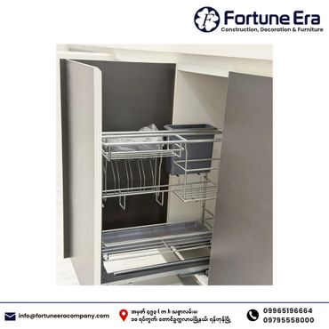Modern pull-out kitchen cabinet organizer with metal racks.