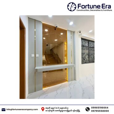 Modern interior with illuminated glass wall and marble floor.