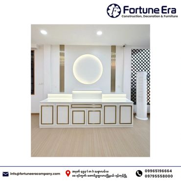 Elegant white and gold altar with illuminated circular backdrop in a modern room.