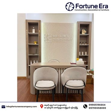 Modern, cozy interior of She Glow & Healing Studio reception with soft chairs and display shelves.