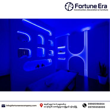 Modern room with blue LED lighting and futuristic wall design.