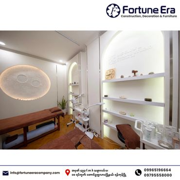 Modern, cozy spa room with ambient lighting and massage tables.