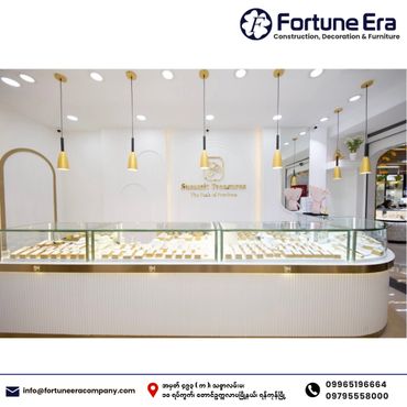 Modern jewelry store interior with elegant lighting and display cases.