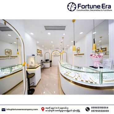 Modern, bright jewelry store interior with glass display cases and elegant lighting.