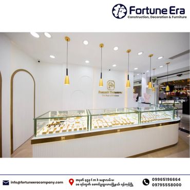 Modern jewelry store interior with elegant lighting and glass display cases.