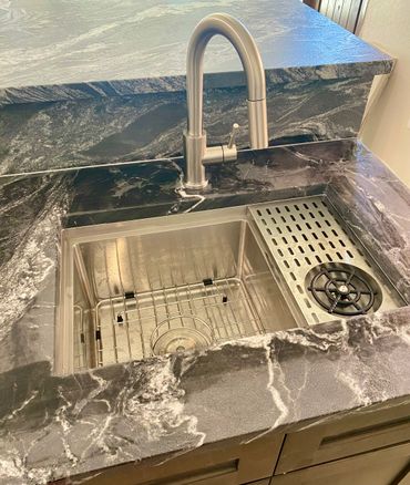 New bar sink and faucet with glass washer. 