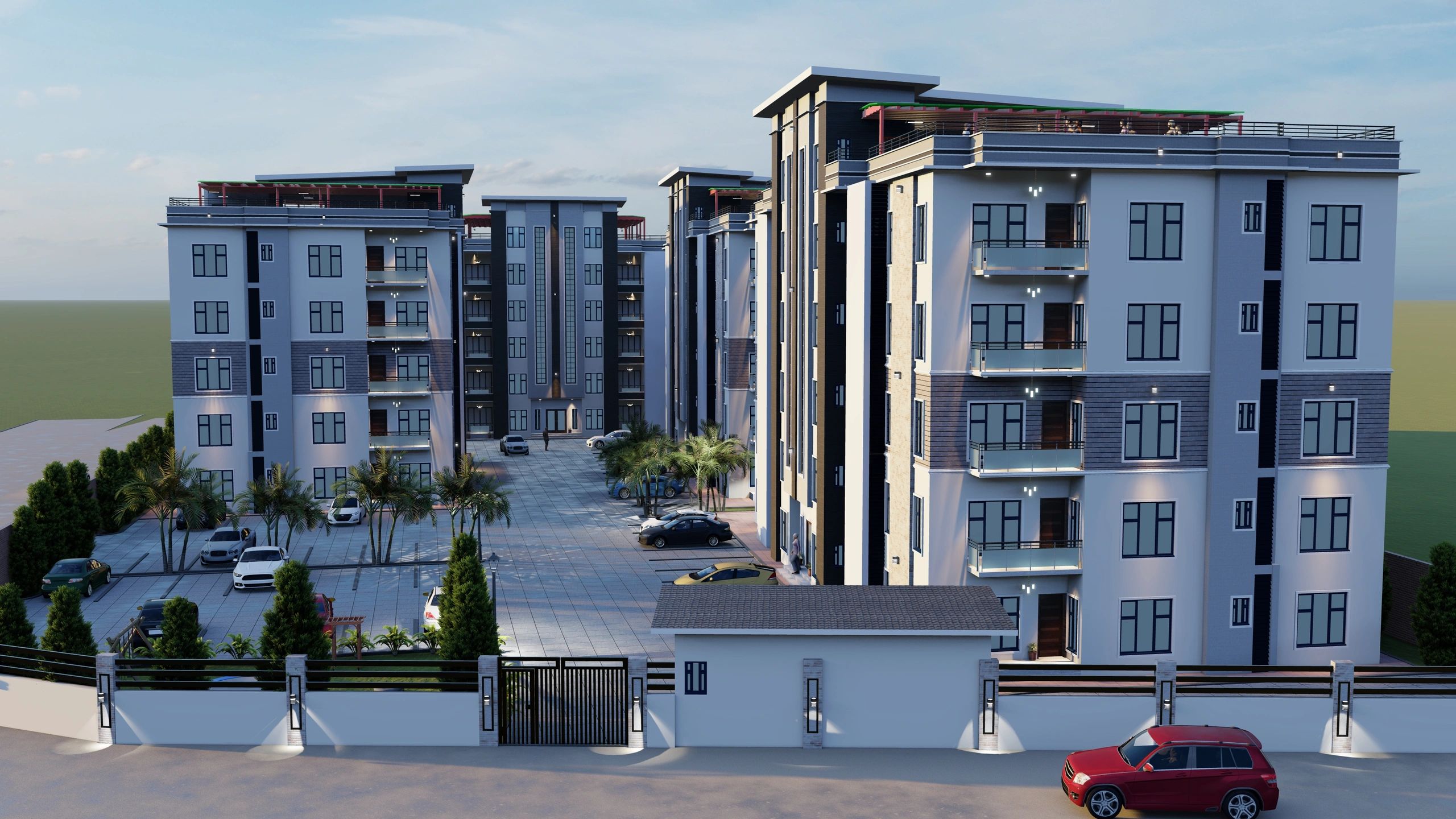 Modern apartment complex with multiple buildings and parked cars in a gated community.