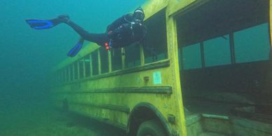 A scuba diver checking out the newest school bus at gilboa quarry in Ottawa ohio.  