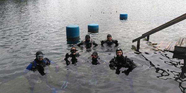 scuba divers at the surface during a training dive