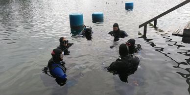 A group of scuba divers getting ready for a guided dive with Lutra Adventures at gilboa quarry