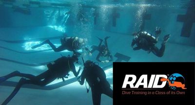 scuba diving students training in pool