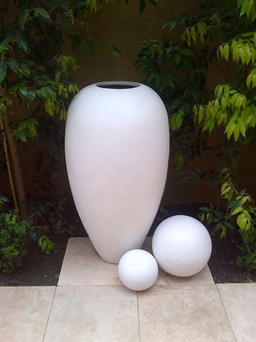 Cluster of White Italian Vessels poolside. 