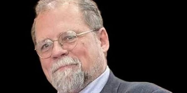 Portrait of a man with glasses and a beard
