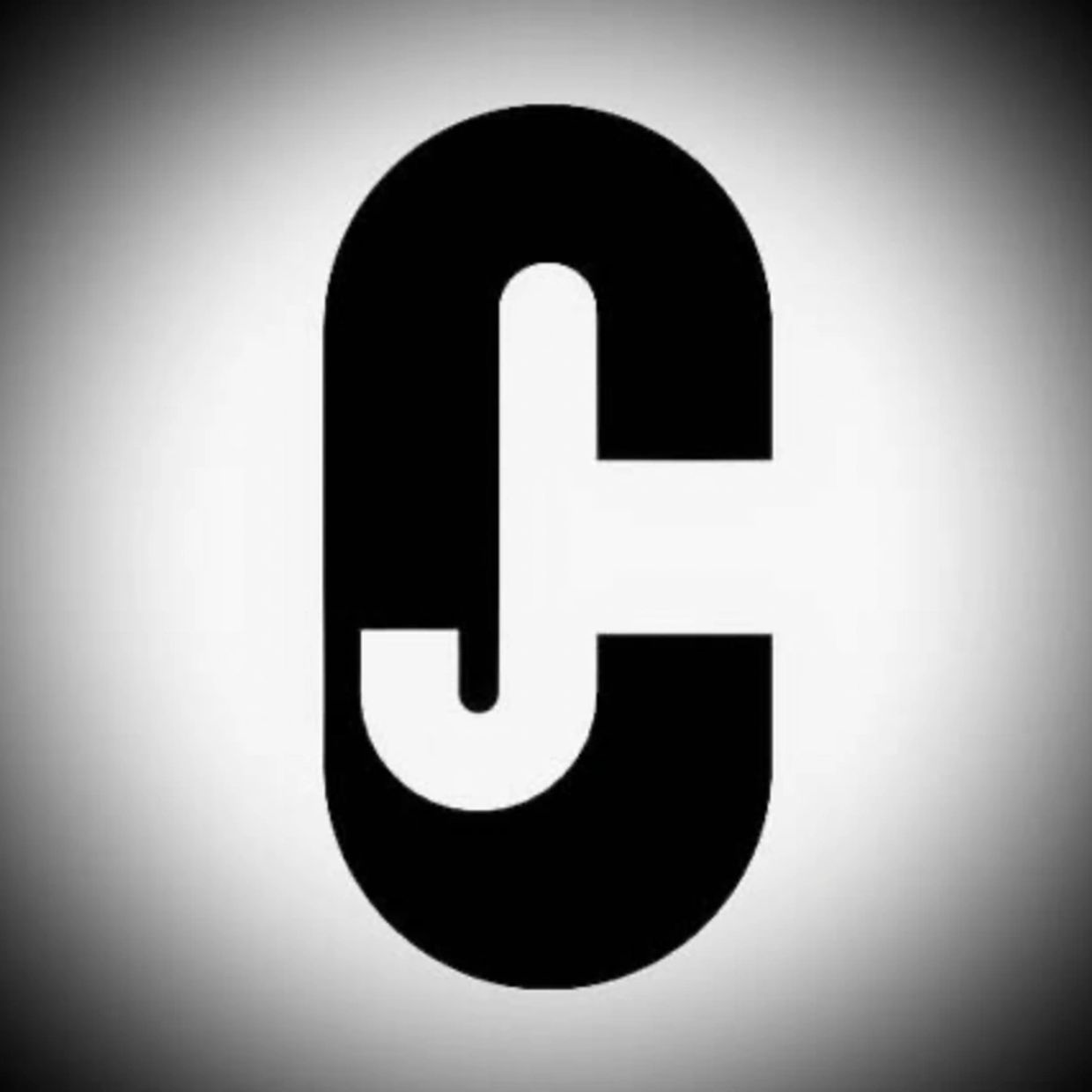 Black and white abstract design resembling the letters J and C.