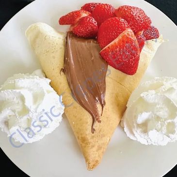 Crepe with Nutella, strawberries, and whipped cream.