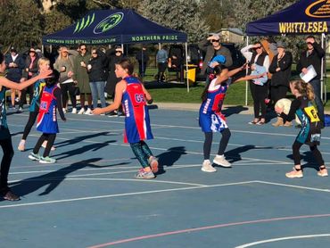 Mernda Netball Players defending the opposition. 