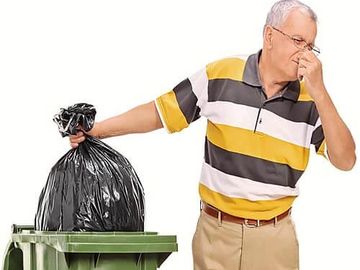 Why You Should Let Your Garbage Can Sit In The Sun After Washing It