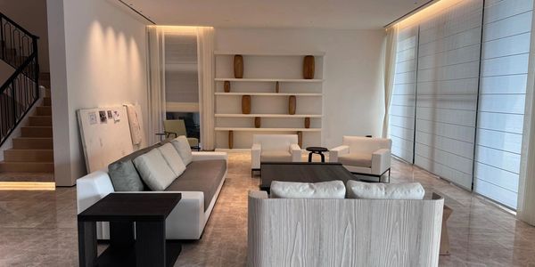 Minimalist living room with neutral tones and modern furniture.