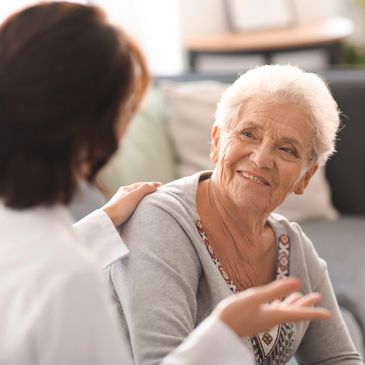 A carer having a conversation with a patient