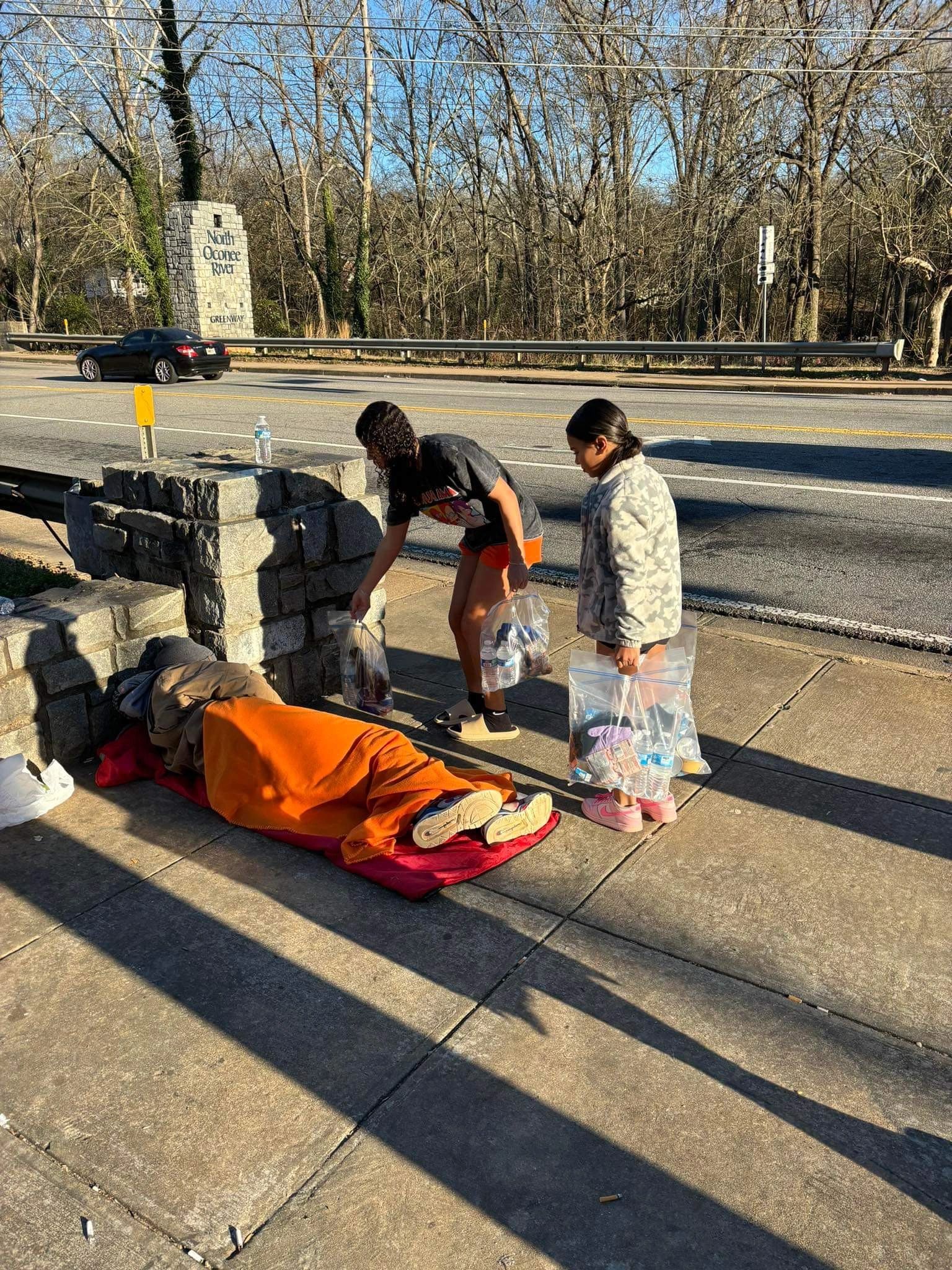 A homeless woman found dead along river near downtown
