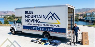Moving truck and worker with equipment and boxes.
