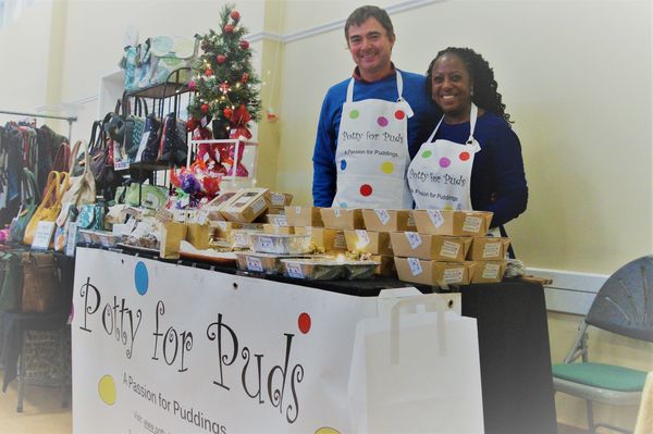 two people selling cookies.