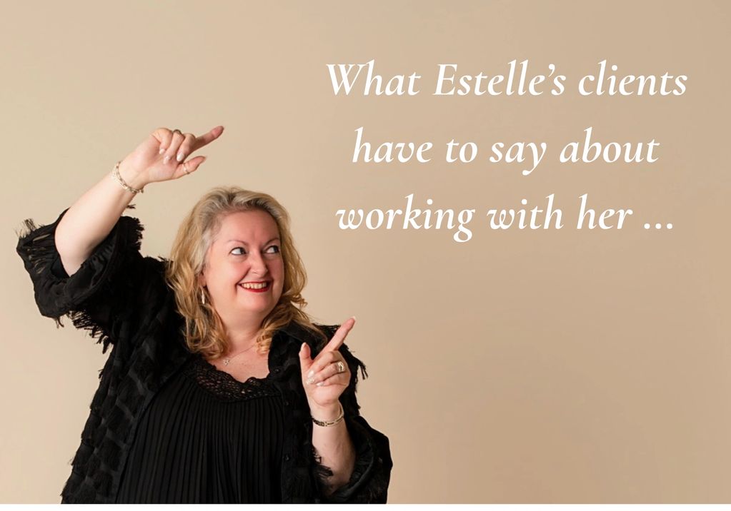 A smiling woman pointing to text about Estelle's client testimonials.
