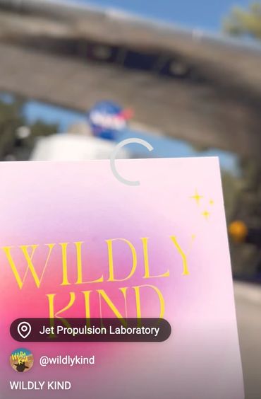 WILDLY KIND card with NASAs Jet Propulsion Laboratory in the background.