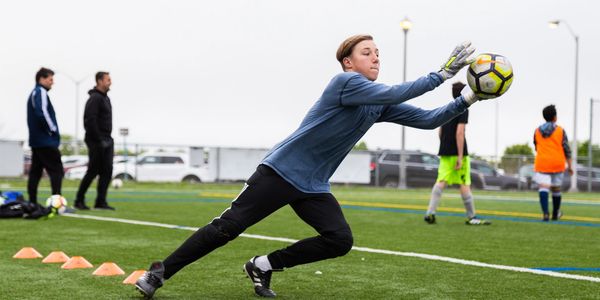 Soccer goalkeeper making a diving save in a soccer drill