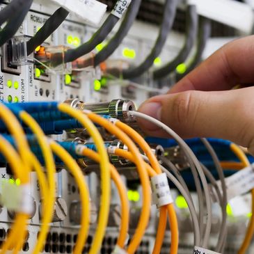 Server technician managing network cables.