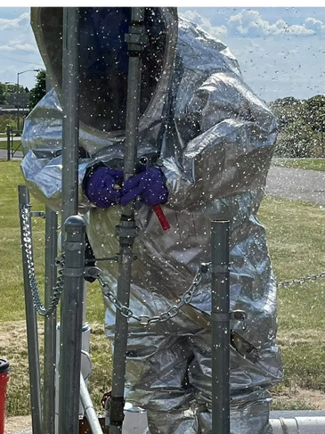 Level A HazMat training Suit working on a HazMat Base Training Prop for 1910 Leak Tree Associates.
