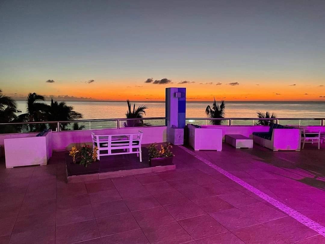 The Sky Bar at Secrets Aura Cozumel offers panoramic views of the gorgeous sunset