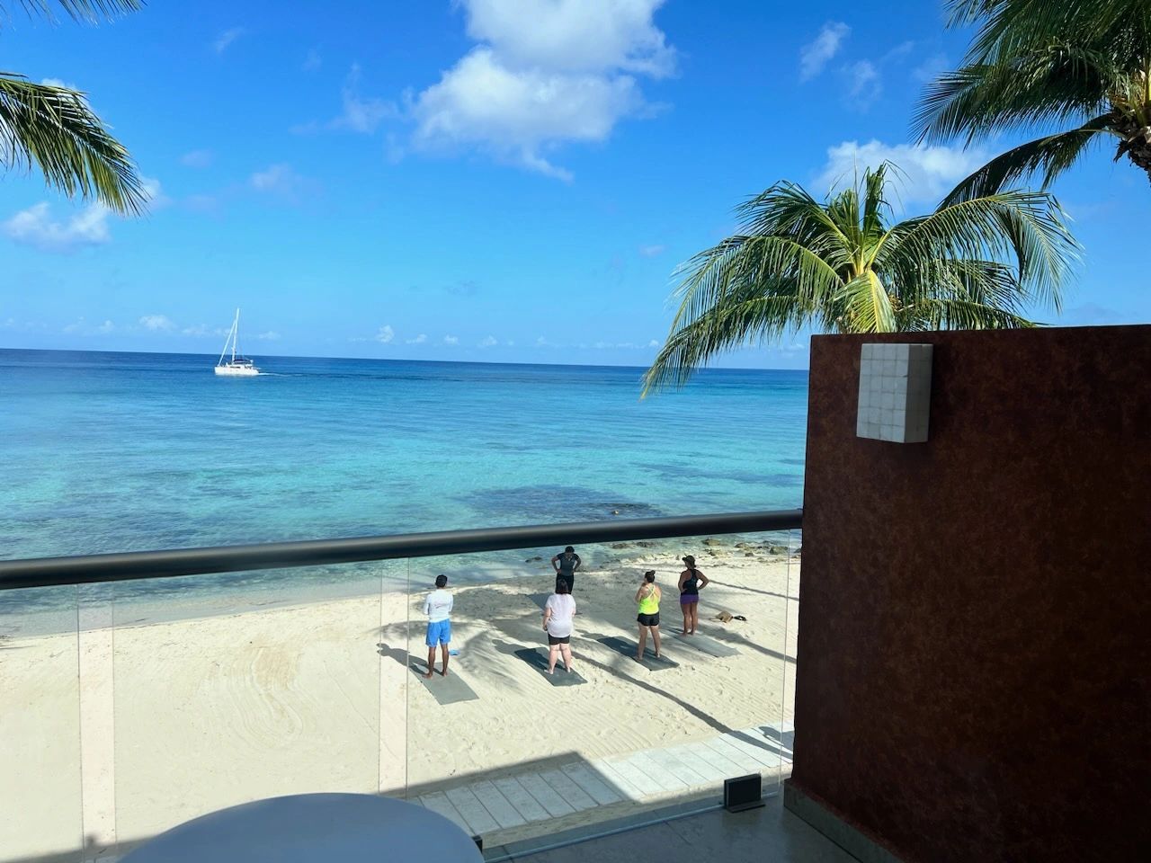 Morning beach yoga right outside our Preferred Club Ocean Front Room!